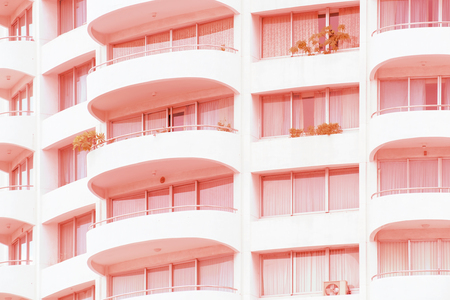 View of balconies of apartment building. Red tone.の写真素材