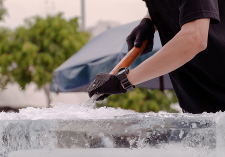 View of sculptor carving ice. Movement.の写真素材