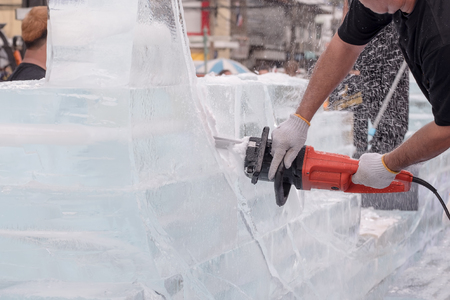 View of sculptor carving ice. Movement.の写真素材