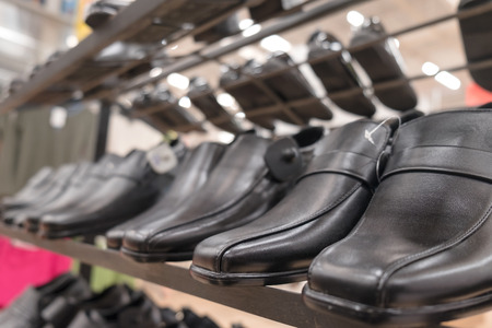 Shoes on shelf in the store. Shallow depth of field.の写真素材