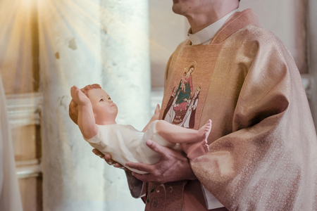 View of pastor in Eucharistic Celebration ceremony. Shallow depth of field.の写真素材