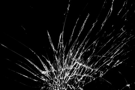Abstract broken mirror on black background. Soft focus.