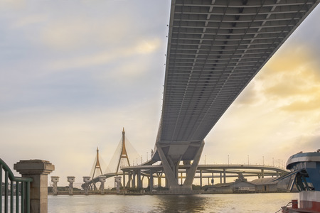 View of elevated expressway cross the river at twilight.