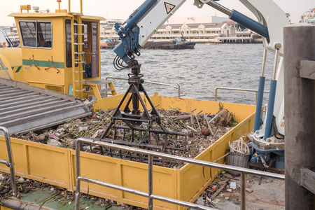 View of weeding machine in the boat on the river.の写真素材