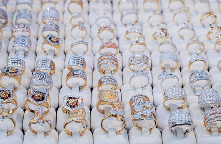 View of rings in glass cabinets. "Thailand Tourism Festival" Annual Folk Art, Lumpini Park, Bangkok, Thailand.の写真素材