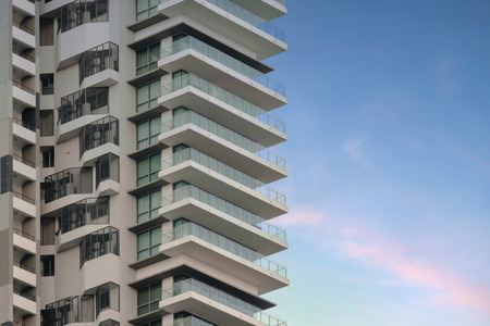 View of balconies of apartment building at twilight.の写真素材