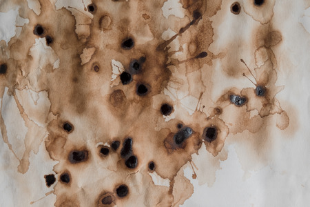 Abstract textured background of coffee stain on paper background.の写真素材