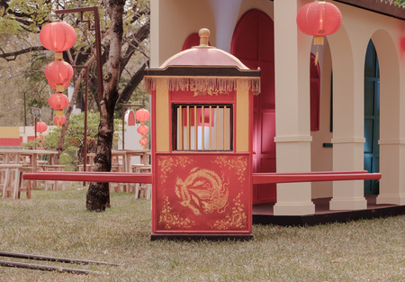 View of traditional Chinese sedan chair on the ground.の写真素材