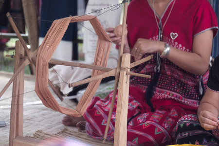 View of young woman spinning thread. Traditional Folk Art. Movement.の写真素材