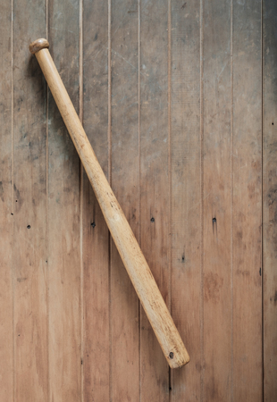 Baseball bat on wood background.の写真素材