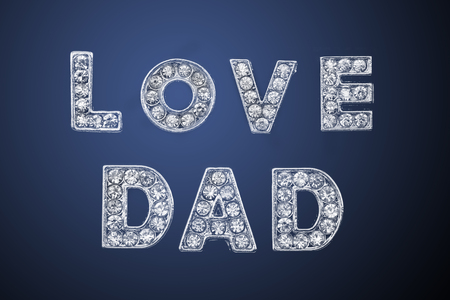 LOVE DAD. View of alphabet jewel on dark background. Father's day concept.の写真素材