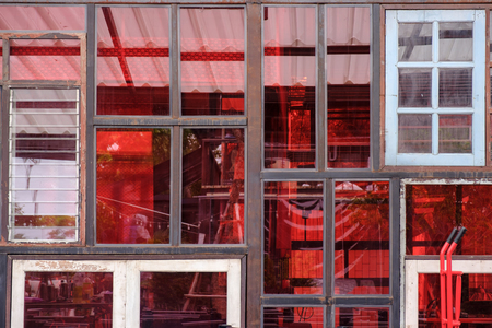 Abstract background of red wall, made from old windows.の写真素材