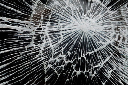 Abstract broken mirror on black background.