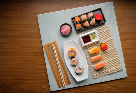 View of japanese food on light blue tile. Sushi set. Top view.の写真素材