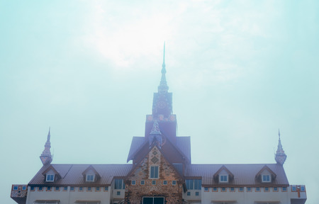 Roof of temple in mist. Wat Prathat Phasornkaew, Khao Kho, Phetchabun, Thailand