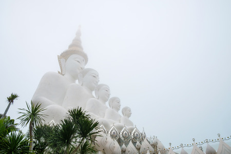 View of statue of Buddha in mist. Wat Prathat Phasornkaew, Khao Kho, Phetchabun, Thailand.の写真素材