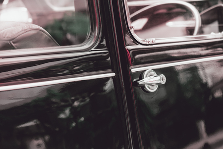 View of door knob on vintage car.の写真素材