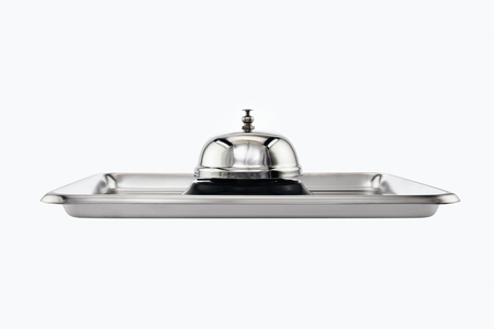 Service bell on stainless tray on white background.の写真素材