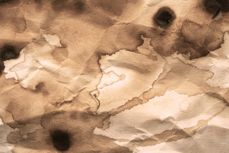 Dry coffee stain on paper background.の写真素材