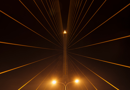 View of slings stretched on Rama 8 bridge at night, Bangkok, Thailand.の写真素材