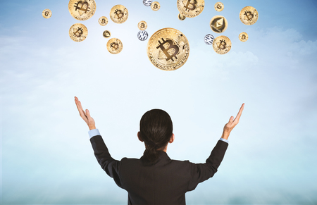 Business man with crypto currency flying on blue sky background.の写真素材