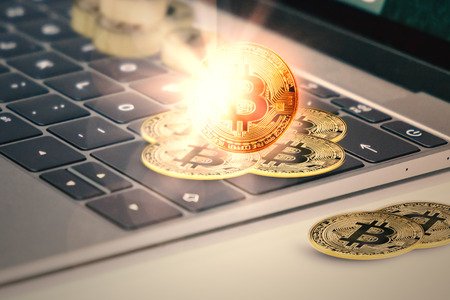 View of cryptocurrency on keyboard of computer. Digital retouch.