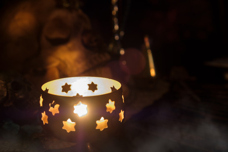 View of candlelight on the table. Soft focus. Dark tone.の写真素材