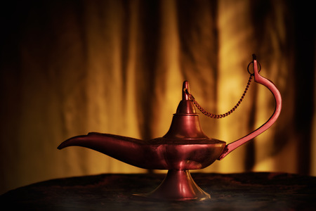 Aladdin lamp on the table. Soft focus.の写真素材