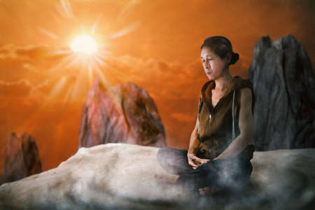 View of man meditating on the mountain in the morning. Digital paint. Watercolor style.の写真素材