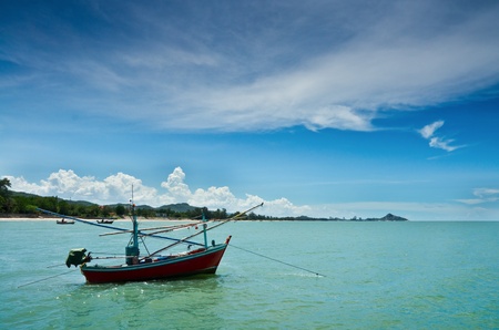 Fishing boat at cha-am beach in Thailandの写真素材