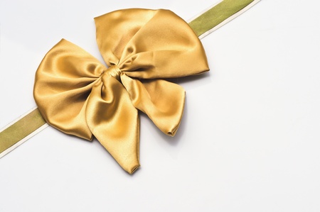 Gold bow isolated on white backgroundの写真素材