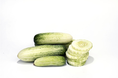 Cucumber and slices isolated on white background.の写真素材