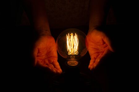 lightbulb on hand ,abstract enegy magic conceptの写真素材