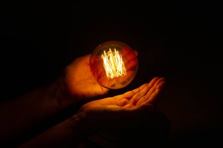 lightbulb on hand ,abstract enegy magic conceptの写真素材