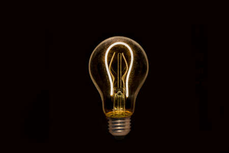 glowing light bulbs on black background