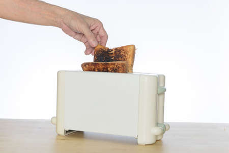 burnt bread toast in the toaster