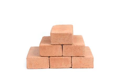 Red bricks isolated on white background. Solid clay bricks used for construction.の写真素材