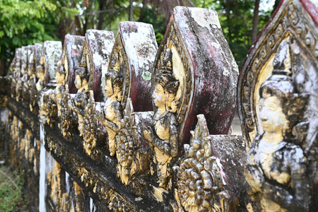 Traditional Thai-style molding art for decorating on the temple wall in Thailandの写真素材