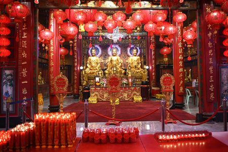Three beautiful golden Buddha sculptures are decorated inside Mangkon Kamalawat temple in Bangkok's...