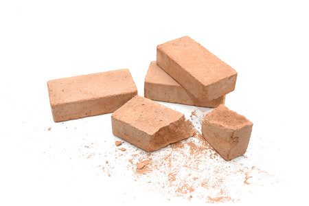 Close-up of brick pieces isolated on a white background