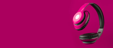 Red headphones on a red backgroundの写真素材