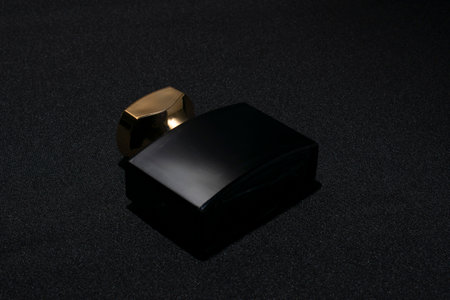 perfume bottle. Mockup on dark or black empty background. Fragrance for man or woman. top view. Horizontal photo with copy spaceの写真素材