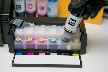 Refilling Inkjet Printer Ink Tanksの写真素材