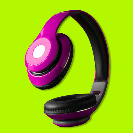 Purple headphones on a green backgroundの写真素材