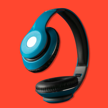 Blue headphones on a red backgroundの写真素材
