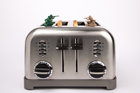Toy soldiers playing in a toaster