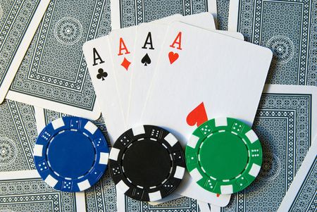 Playing Cards with 4 aces and poker chips