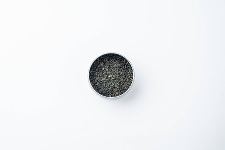 Dried tea in tin isolated on a white backgroundの写真素材