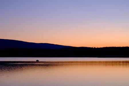 fisherman in sunsetの写真素材