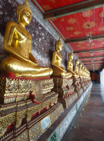 perspective of golden statue  Buddha place in square balcony of Thai templeの写真素材